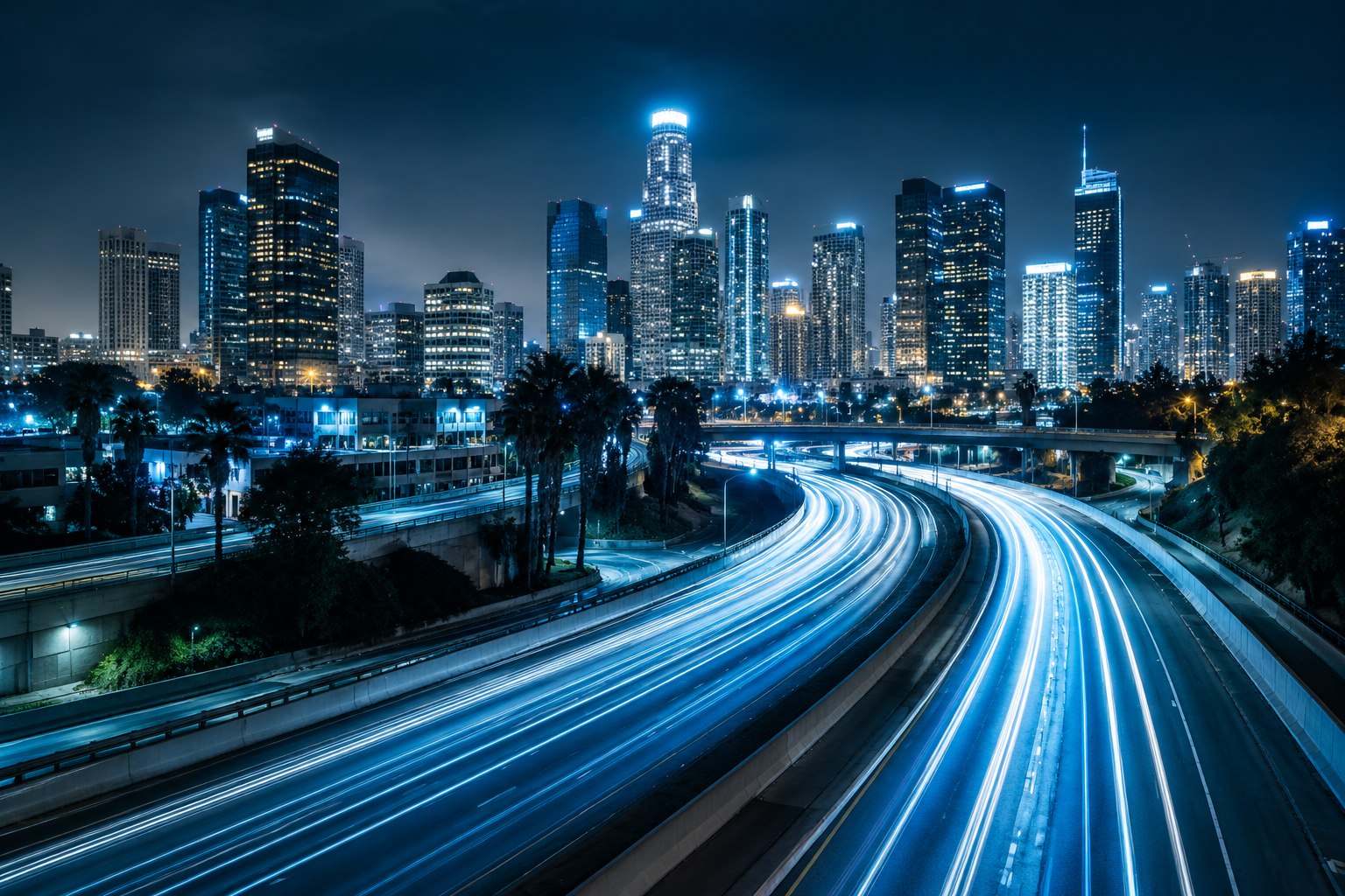 Bright light trails flowing through a city at night, evoking online traffic and audience growth